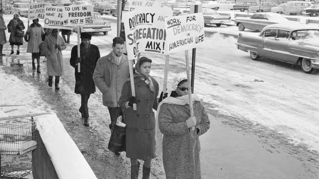 Englewood, NJ: Protest segregated schools: Pickets in front of the Municipal Building here February 2nd, to protest the arrest of 11 persons during sit-in demonstrations protesting allegedly segregated school. The sit-in took place Feb.1 and Feb 2. at City Hall in protest to a Board of education ruling barring nine Negro children from predominantly white Quarles School Feb 1., because of a zoning restriction.