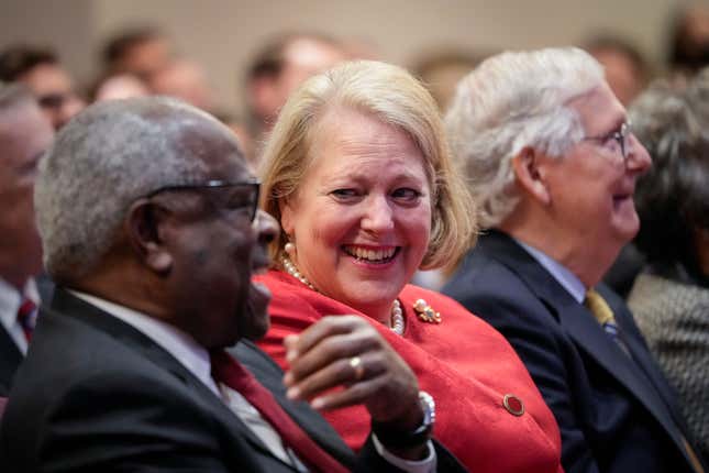 Associate Supreme Court Justice Clarence Thomas sits with his wife and conservative activist Virginia Thomas while he waits to speak at the Heritage Foundation on October 21, 2021 in Washington, DC