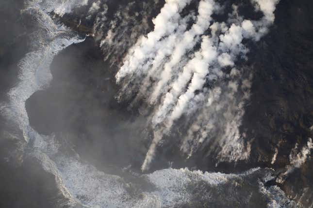 Image for article titled New aerial photos show Kilauea’s lava devouring neighborhoods