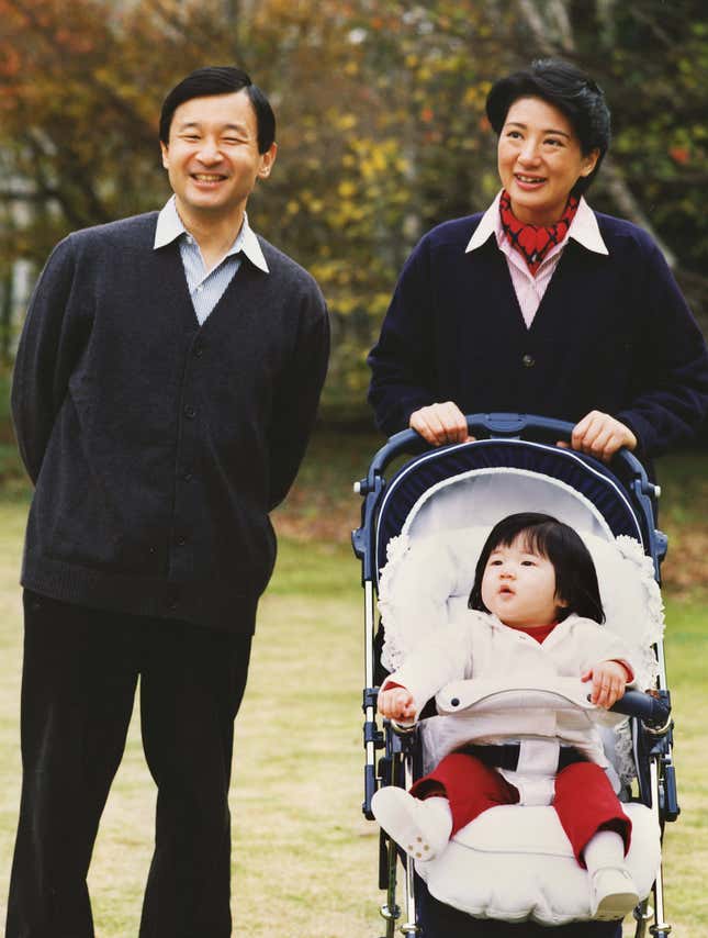 Crown princess Masako with crown prince Naruhito, and their daughter princess Aiko, walking in the gardens of Togu Palace in Tokyo.