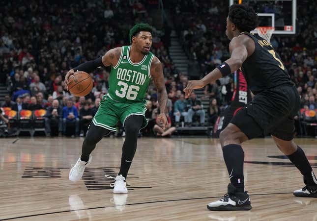 Jan 21, 2023; Toronto, Ontario, CAN; Boston Celtics guard Marcus Smart (36) controls the ball asToronto Raptors forward O.G. Anunoby (3) tries to defend during the first quarter at Scotiabank Arena.