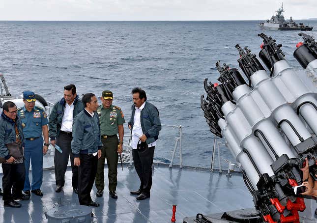 In this June 23, 2016 file photo released by the Indonesian Presidential Office, Indonesian President Joko Widodo, third right, accompanied by, from left to right, Cabinet Secretary Pramono Anung, Navy Chief of Staff, Adm. Ade Supandi, top Security Minister Luhut Panjaitan, Armed Forces Chief Gen. Gatot Nurmantyo and Riau Islands Gov. Nurdin Basirun stands on the deck of navy warship KRI Imam Bonjol, on the waters of Natuna Islands, Indonesia. Indonesia doesn’t have a territorial dispute with China, but Beijing’s nine-dash line, which signifies its claims, overlaps with Indonesia’s internationally recognized exclusive economic zone extending from the Natuna islands.