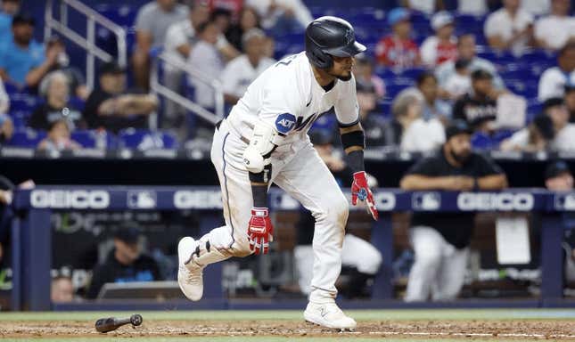 Jun 6, 2023; Miami, Florida, USA; Miami Marlins second baseman Luis Arraez (3) scores on a wild pitch against the Kansas City Royals during the seventh inning at loanDepot Park.