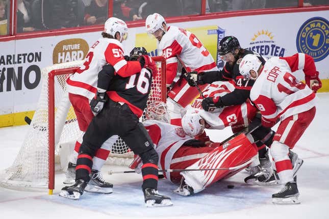 Feb 27, 2023; Ottawa, Ontario, CAN; Detroit Red Wings goalie Magnus Hellberg (45) tries to cover the puck in a scramble in fron the the net in the third period against the Ottawa Senators at the Canadian Tire Centre.