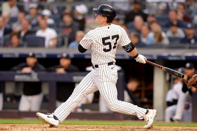 Jun 21, 2023; Bronx, New York, USA; New York Yankees left fielder Billy McKinney (57) follows through on a solo home run against the Seattle Mariners during the fourth inning at Yankee Stadium.
