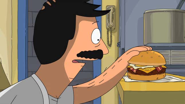 Bob Belcher lovingly pats a burger, featuring a fried egg, cheese, and rashers of bacon.
