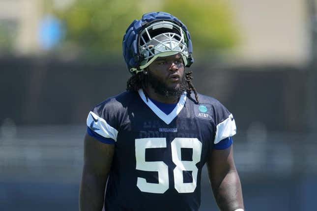 Jul 29, 2023; Oxnard, CA, USA; Dallas Cowboys defensive tackle Mazi Smith (58) wears a Guardian helmet cap during training camp at the River Ridge Fields.