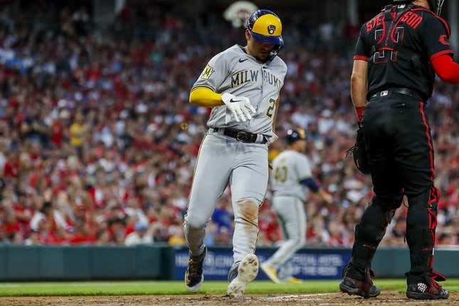 Jul 14, 2023; Cincinnati, Ohio, USA; Milwaukee Brewers shortstop Willy Adames (27) scores on a RBI single hit by catcher Victor Caratini (not pictured) in the seventh inning against the Cincinnati Reds at Great American Ball Park.