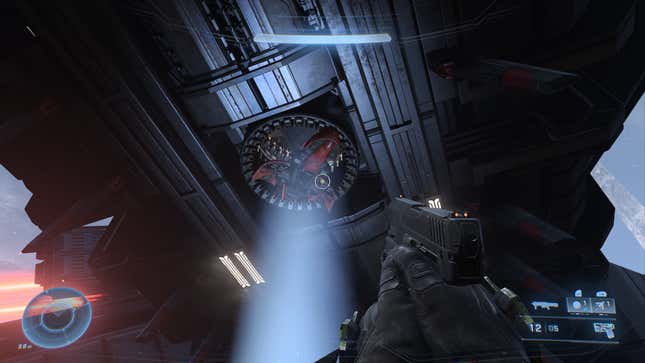 A ghost is stuck in a gravity lift underneath a giant Covenant structure in Halo Infinite.