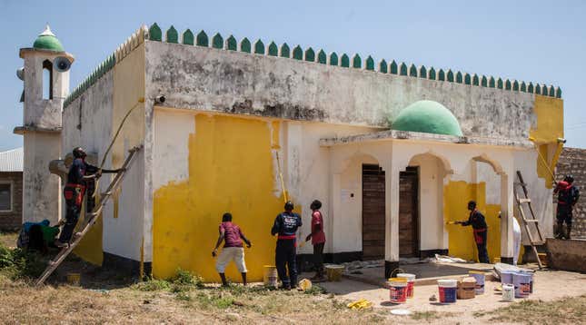 Image for article titled An artist has painted mosques and churches across Kenya yellow to promote peace