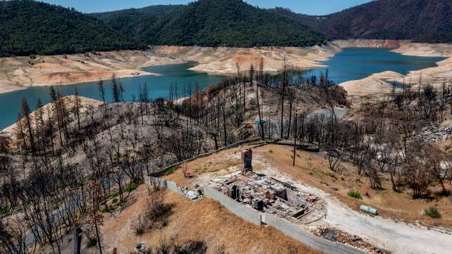 A home scorched in the 2020 North Complex Fire rests above Lake Oroville on May 23, 2021, in Oroville, California. 