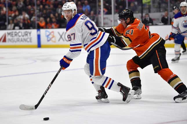 Apr 5, 2023; Anaheim, California, USA; Edmonton Oilers center Connor McDavid (97) moves the puck against Anaheim Ducks center Isac Lundestrom (21) during the first period at Honda Center.