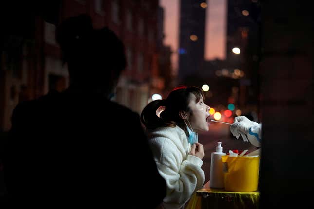 A woman gets tested for covid in Shanghai, China.