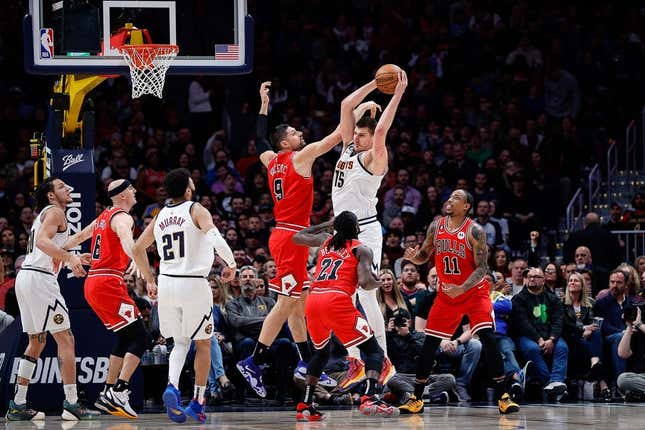 Mar 8, 2023; Denver, Colorado, USA; Denver Nuggets center Nikola Jokic (15) grabs a rebound against Chicago Bulls center Nikola Vucevic (9) as guard Patrick Beverley (21) and forward DeMar DeRozan (11) and guard Jamal Murray (27) and guard Alex Caruso (6) defend in the second quarter at Ball Arena.
