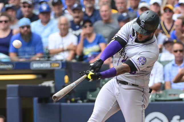 Aug 9, 2023; Milwaukee, Wisconsin, USA; Colorado Rockies designated hitter Jurickson Profar (29) hits a solo home run against the Milwaukee Brewers in the fourth inning at American Family Field.