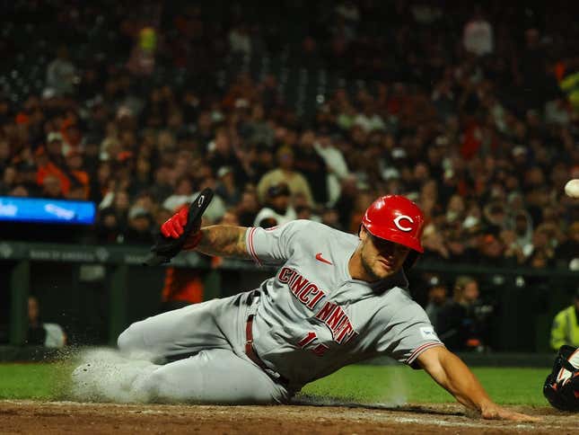 Aug 28, 2023; San Francisco, California, USA; Cincinnati Reds left fielder Nick Senzel (15) scores a run against the San Francisco Giants during the eighth inning at Oracle Park.