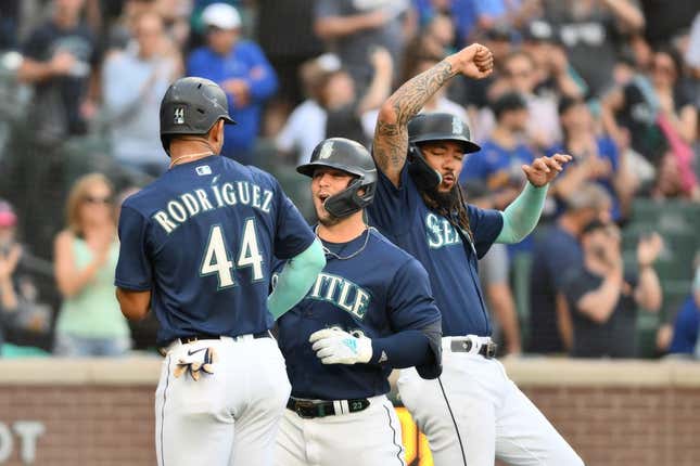 Jun 12, 2023; Seattle, Washington, USA; Seattle Mariners center fielder Julio Rodriguez (44) and first baseman Ty France (23) and shortstop J.P. Crawford (3) celebrate after France hit a three-run home run against the Miami Marlins during the second inning at T-Mobile Park.