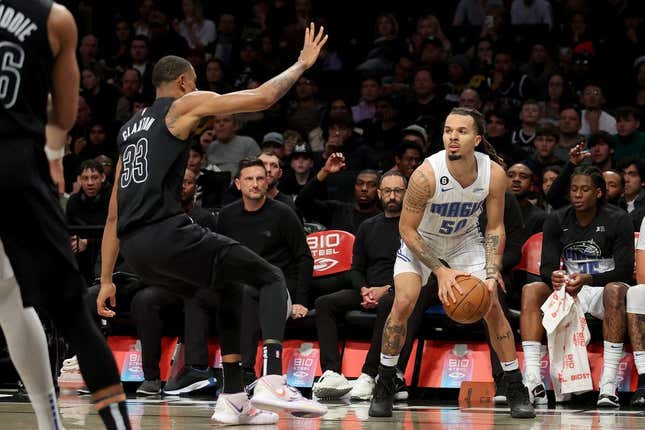 Apr 7, 2023; Brooklyn, New York, USA; Orlando Magic guard Cole Anthony (50) looks to shoot the ball against Brooklyn Nets center Nic Claxton (33) during the second quarter at Barclays Center.