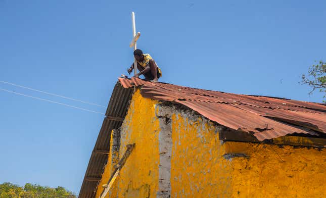 Image for article titled An artist has painted mosques and churches across Kenya yellow to promote peace