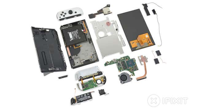 A photo showing the new Nintendo Switch — OLED Model broken down to its component parts. 
