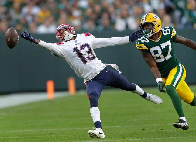 New England Patriots cornerback Jack Jones (13) tries to intercept an overthrown pass to Green Bay Packers wide receiver Romeo Doubs (87) during their football game Sunday, October 2, at Lambeau Field in Green Bay, Wis.Dan Powers/USA TODAY NETWORK-Wisconsin

Apc Packvspatriots 1002221895djpd