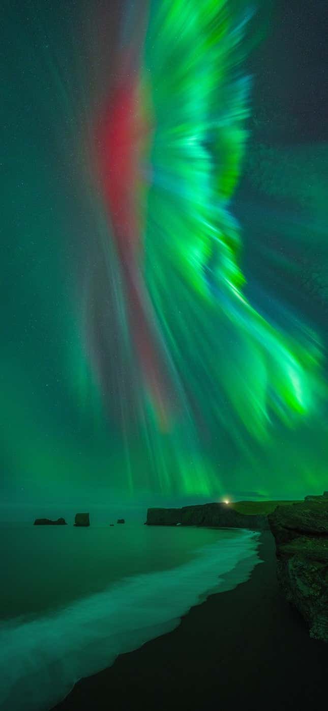 Luminous red and green streaks of the Aurora borealis.