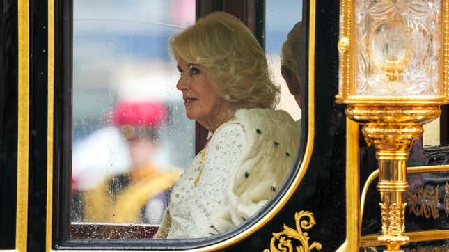 Queen Camilla rides in a the carriage with King Charles lll during the Royal Procession before the King’s Coronation in London on Saturday, May 6, 2023.