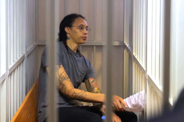 Brittney Griner, who was detained at Moscow’s Sheremetyevo airport and later charged with illegal possession of cannabis, sits inside a defendants’ cage after the court’s verdict during a hearing in Khimki outside Moscow, on August 4, 2022. (Photo by EVGENIA NOVOZHENINA / POOL / AFP) (Photo by EVGENIA NOVOZHENINA/POOL/AFP via Getty Images)