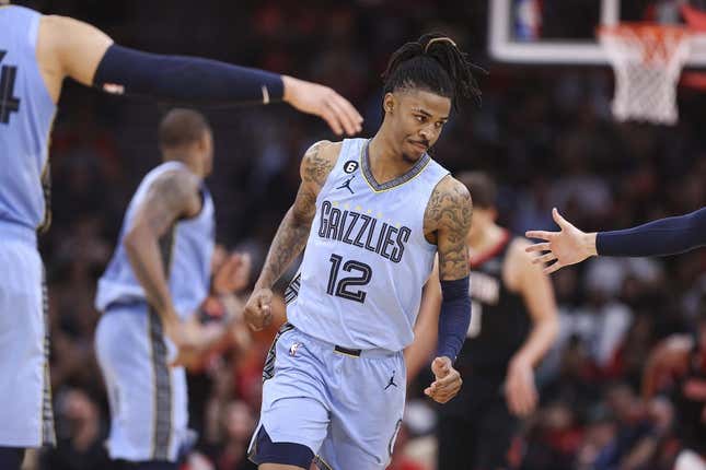 Mar 1, 2023; Houston, Texas, USA; Memphis Grizzlies guard Ja Morant (12) reacts after scoring a basket during the third quarter against the Houston Rockets at Toyota Center.