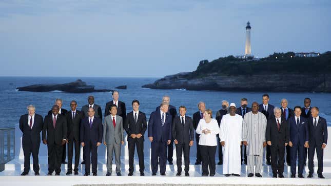 Group of Seven leaders and guests pose for the G7 family photo Sunday, Aug. 25, 2019 in Biarritz.