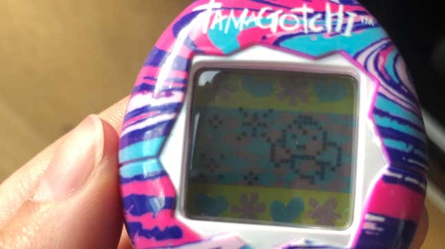 A Tamagotchi flies across a sparkly screen.