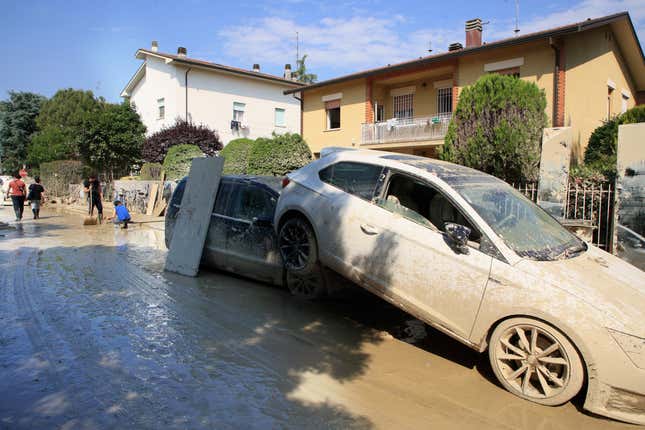 Photo of cars piled and covered successful mud