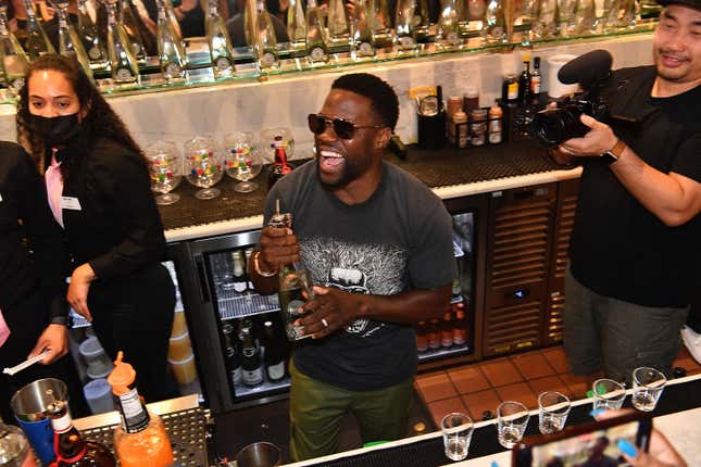 ORLANDO, FLORIDA - SEPTEMBER 16: Kevin Hart prepares cocktails during the presentation of his new goblets made with his Gran Coramino Tequila at Sugar Factory American Brasserie on September 16, 2022 in Orlando, Florida