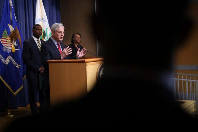 U.S. Attorney General Merrick Garland (C) speaks at a press conference with EPA Administrator Michael Regan (L) on May 5, 2022, in Washington, DC. 