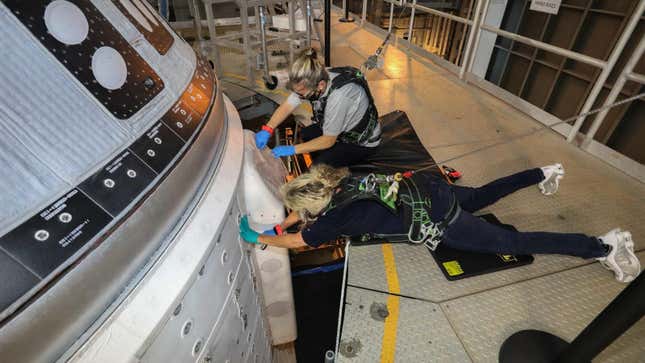 Boeing engineers attending to the glitchy Starliner, currently parked inside the Vertical Integration Facility (VIF) at Space Launch Complex-41.