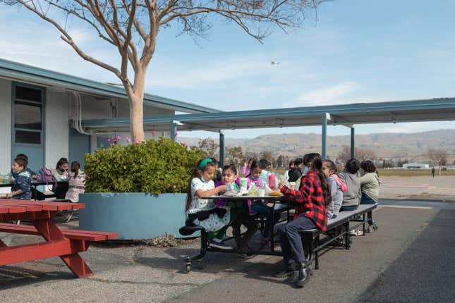 Above: Outdoor lunch at Donald J. Meyer Elementary School. Below left, the school’s play yard. Below right, the nearby runway at Reid-Hillview Airport.