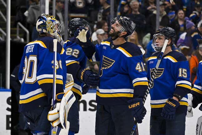 Mar 19, 2023; St. Louis, Missouri, USA; St. Louis Blues goaltender Joel Hofer (30) defenseman Robert Bortuzzo (41) and left wing Jakub Vrana (15) celebrate after the Blues defeated the Winnipeg Jets at Enterprise Center.