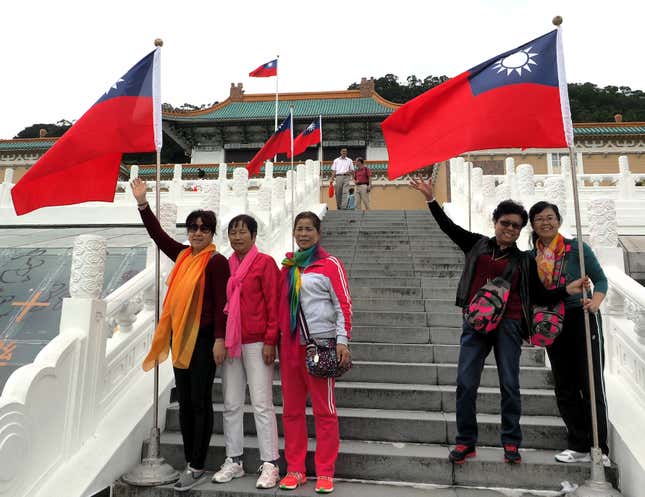 Chinese tourists pose at Taipei’s National Palace Museum in October 2015.