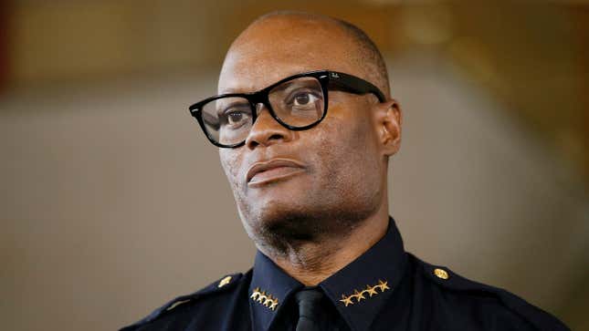 Dallas Police Chief David Brown briefs the media about a shooting at Dallas Police headquarters, Saturday, June 13, 2015, in Dallas. At least one gunman opened fire on officers outside of police headquarters in Dallas early Saturday, spraying squad cars with bullets before fleeing in a van, which officers followed to a suburban parking lot and surrounded, beginning a standoff, Brown said. (AP Photo/Tony Gutierrez)