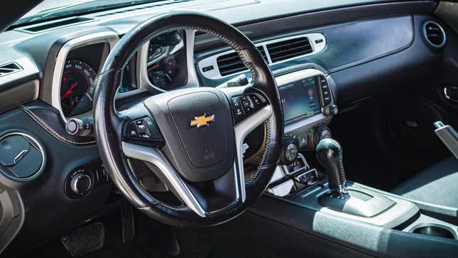 The interior of a Chevy SUV showing the driver's side