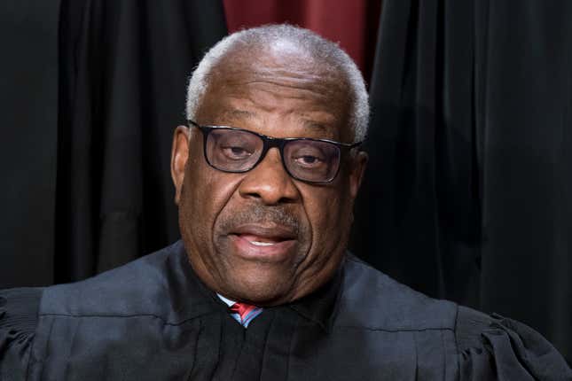 Associate Justice Clarence Thomas joins other members of the Supreme Court as they pose for a new group portrait, at the Supreme Court building in Washington, Friday, Oct. 7, 2022.