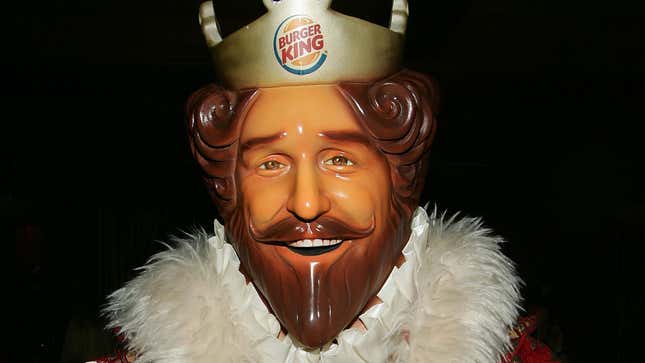 A close-up of the creepy Burger King mascot's shiny plastic face. 