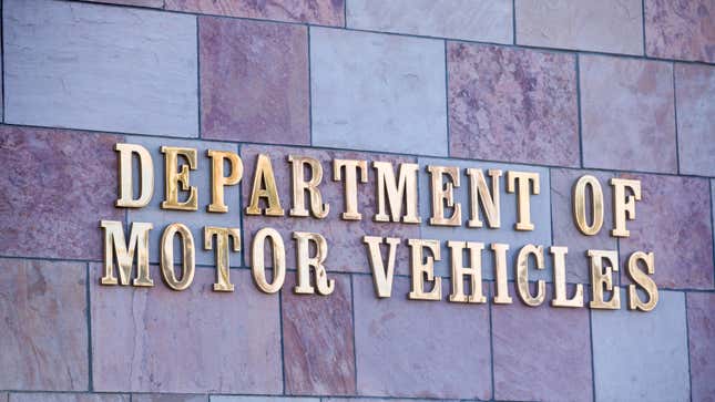 Department of Motor Vehicles sign on side of building