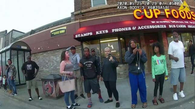 This May 25, 2020, file image from a police body camera shows bystanders including  Charles McMillan, center left in light colored shorts, Christopher Martin center in gray, Donald Williams, center in black, Genevieve Hansen, fourth from right filming, Darnella Frazier, third from right filming, as former Minneapolis police officer Derek Chauvin was recorded pressing his knee on George Floyd’s neck for several minutes in Minneapolis.