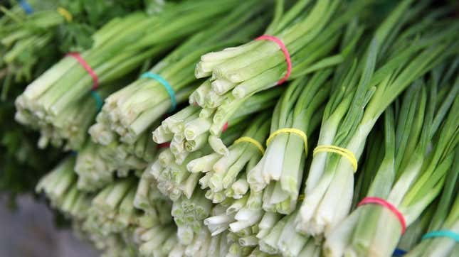 Bunches of scallions for sale at a market
