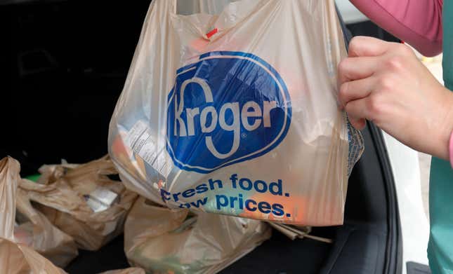FILE - A customer removes her purchases at a Kroger grocery store in Flowood, Miss., Wednesday, June 26, 2019. Kroger and Albertsons are selling more than 400 stores and other assets to C&S Wholesale Grocers in an approximately $1.9 billion deal as part of their efforts to complete their merger, Friday, Sept. 8, 2023. (AP Photo/Rogelio V. Solis, File)