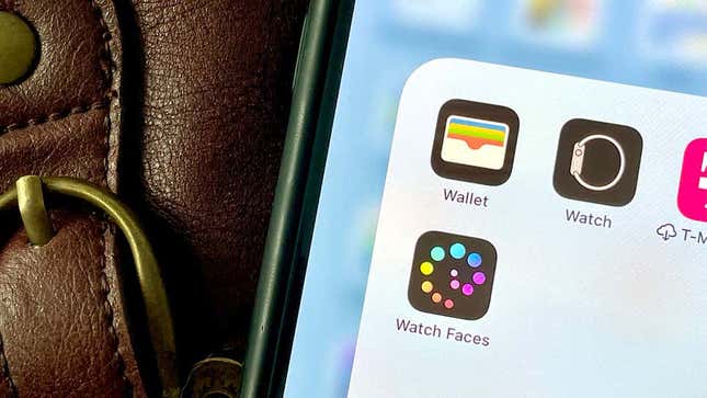 A photo of an iPhone with focus on the Wallet app 