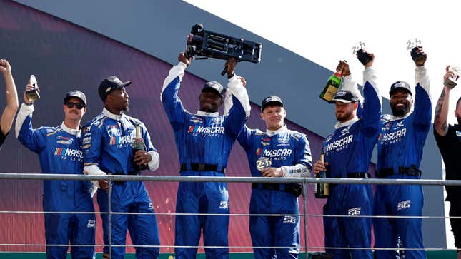 The pit crew for the NASCAR Next Gen Chevrolet ZL1 celebrate after winning the pit stop challenge