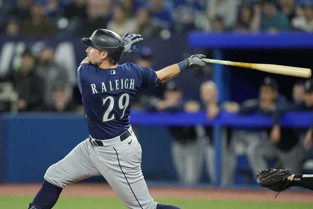 Apr 30, 2023; Toronto, Ontario, CAN; Seattle Mariners catcher Cal Raleigh (29) hits a two run home run against the Toronto Blue Jays during the tenth inning at Rogers Centre.