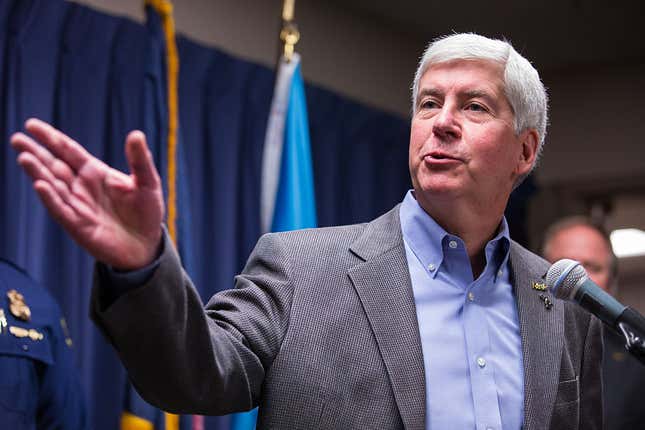 : Michigan Gov. Rick Snyder speaks to the media regarding the status of the Flint water crisis on January 27, 2016, at Flint City Hall in Flint, Michigan.
